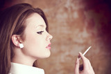 beautiful girl smoking cigarette grunge background