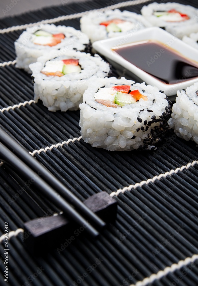 Sushi set on black bamboo mat Sushi set on black bamboo mat