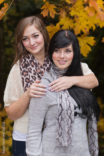 Beautiful elegant young women and autumn colors.