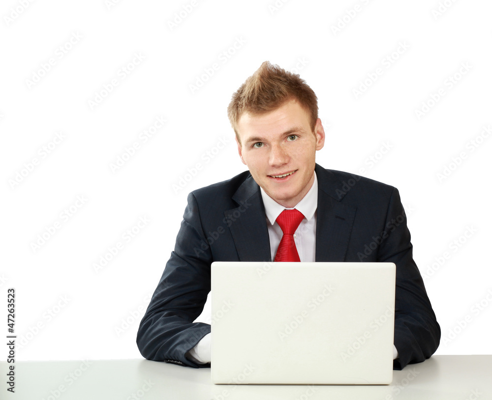 Young businessman at his workplace, isolated on white background Young businessman at his workplace, isolated on white background