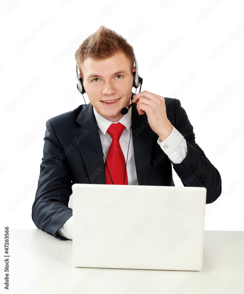 A portrait of a young man working on a laptop A portrait of a young man working on a laptop