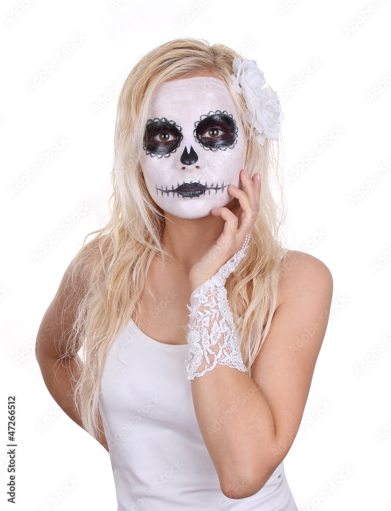 skull makeup on young girl with white roses and lace gloves