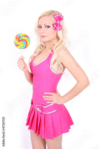 blonde girl in pink dress with colorful lollipop isolated