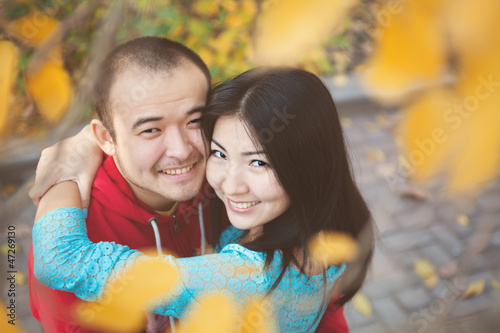Happy asian couple in love in autumn