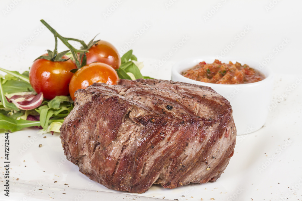 Grilled Beef Steak Isolated On a White Background Grilled Beef Steak Isolated On a White Background