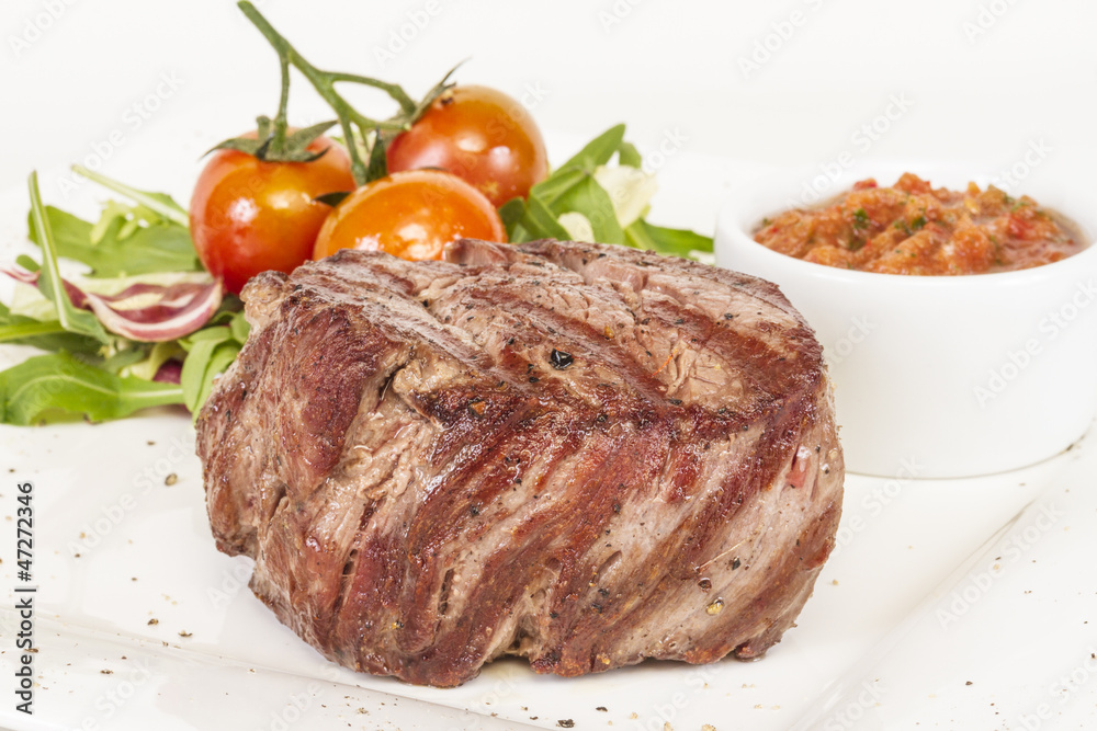 Grilled Beef Steak Isolated On a White Background Grilled Beef Steak Isolated On a White Background