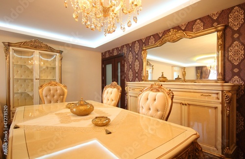 Wealthy classic dinning room and the furnitures photo