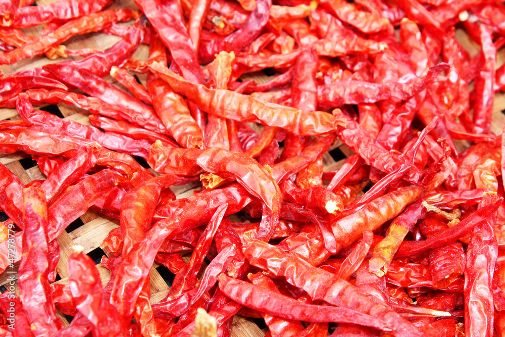 Chili peppers drying in the sun in Thailand.