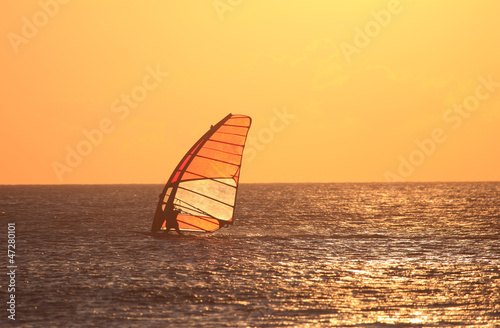 Backlit windsurfer at sunset. Tarifa, Andalusia Spain