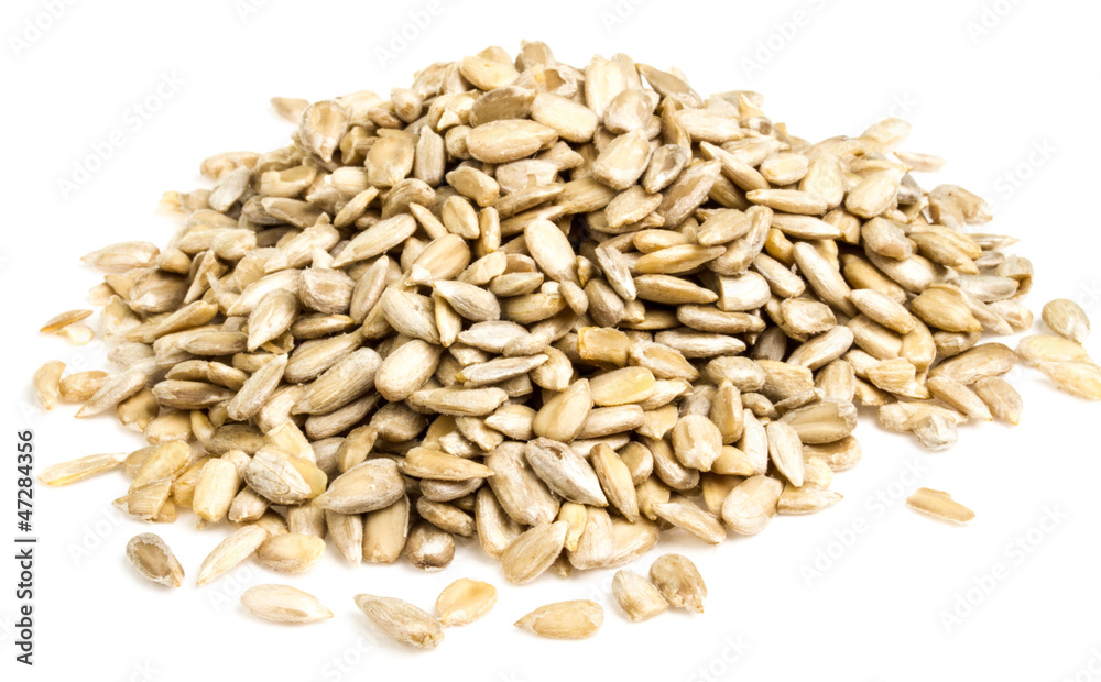 fresh sunflower seeds isolated on a white background