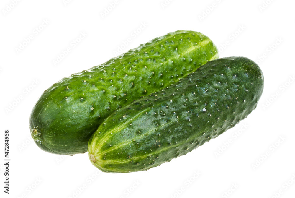 Healthy food. The green cucumbers isolated on white background Healthy food. The green cucumbers isolated on white background