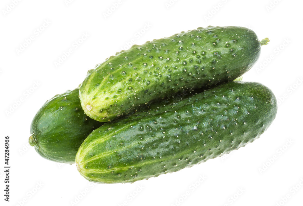 Healthy food. The green cucumbers isolated on white background Healthy food. The green cucumbers isolated on white background