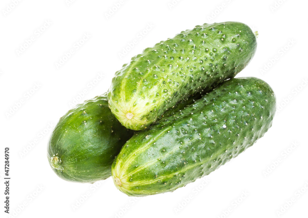 Healthy food. The green cucumbers isolated on white background Healthy food. The green cucumbers isolated on white background