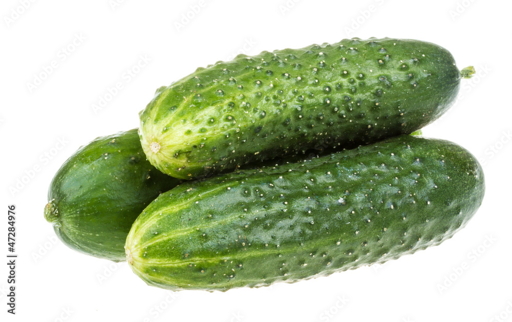 Healthy food. The green cucumbers isolated on white background Healthy food. The green cucumbers isolated on white background