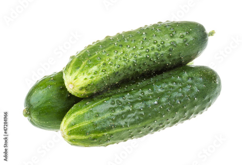 Healthy food. The green cucumbers isolated on white background