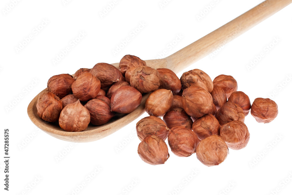 Wooden spoon with hazelnut