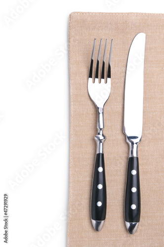 fork and knife on a flax napkin