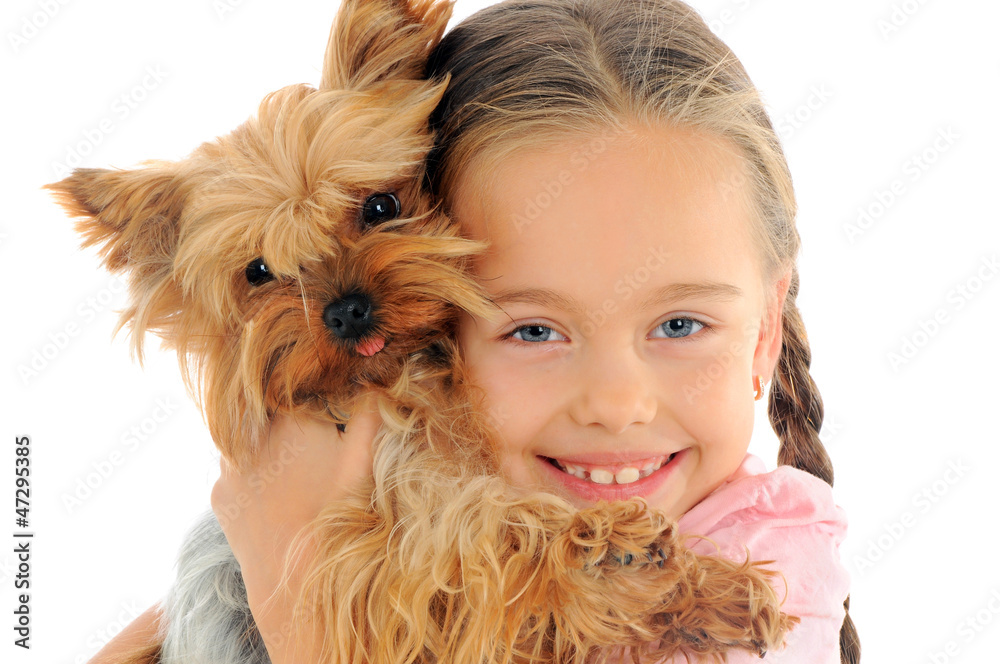 Happy child playing with dog