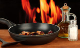 roasted chestnuts in the pan and decanter with oil, salt and