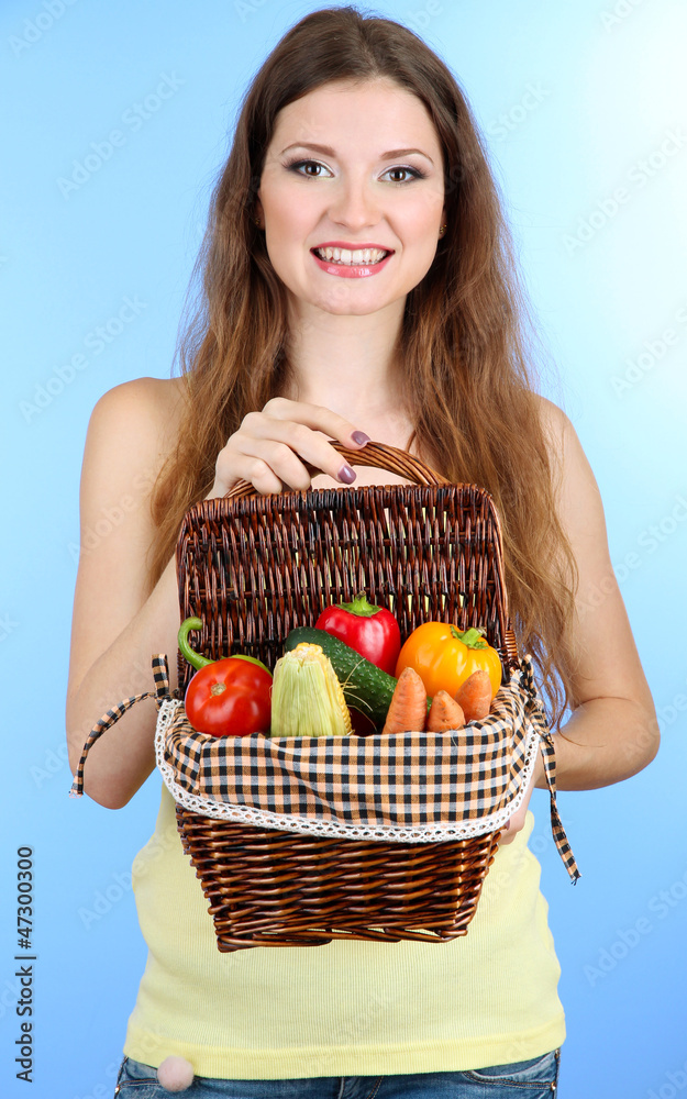 Beautiful woman with vegetables in wicker basket Beautiful woman with vegetables in wicker basket