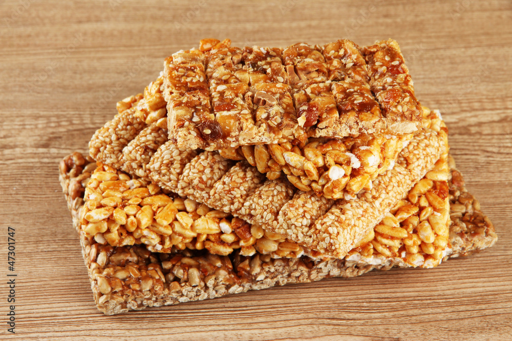 tasty sweets (kozinaki), on wooden background tasty sweets (kozinaki), on wooden background