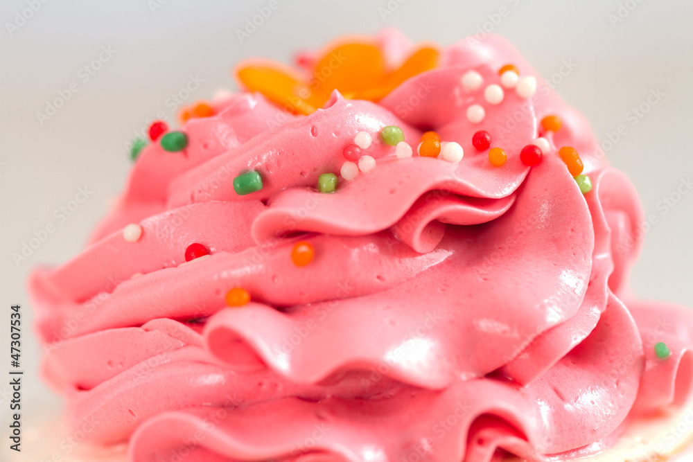 pink cream and topping on cupcake pink cream and topping on cupcake