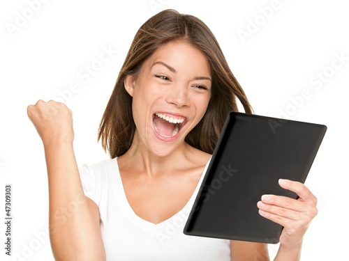 Tablet computer woman winning happy excited