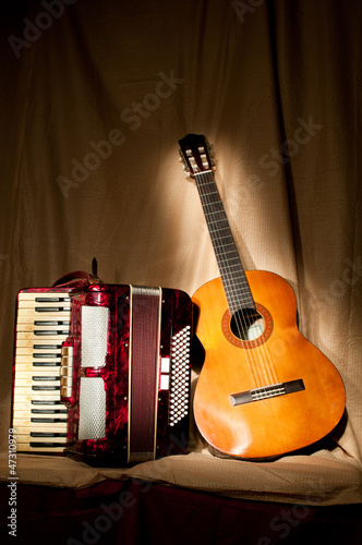 Retro accordion and acoustic guitar photo