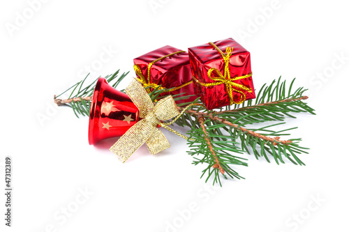 red christmas bell with fir branch on white