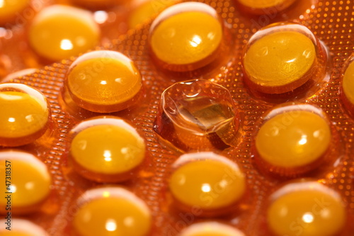 Background from macro of yellow medicine pills
