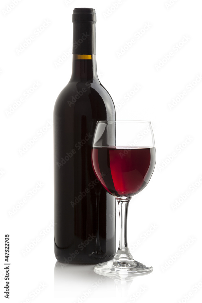 Elegant red wine glass and a wine bottle isolated on a white Elegant red wine glass and a wine bottle isolated on a white