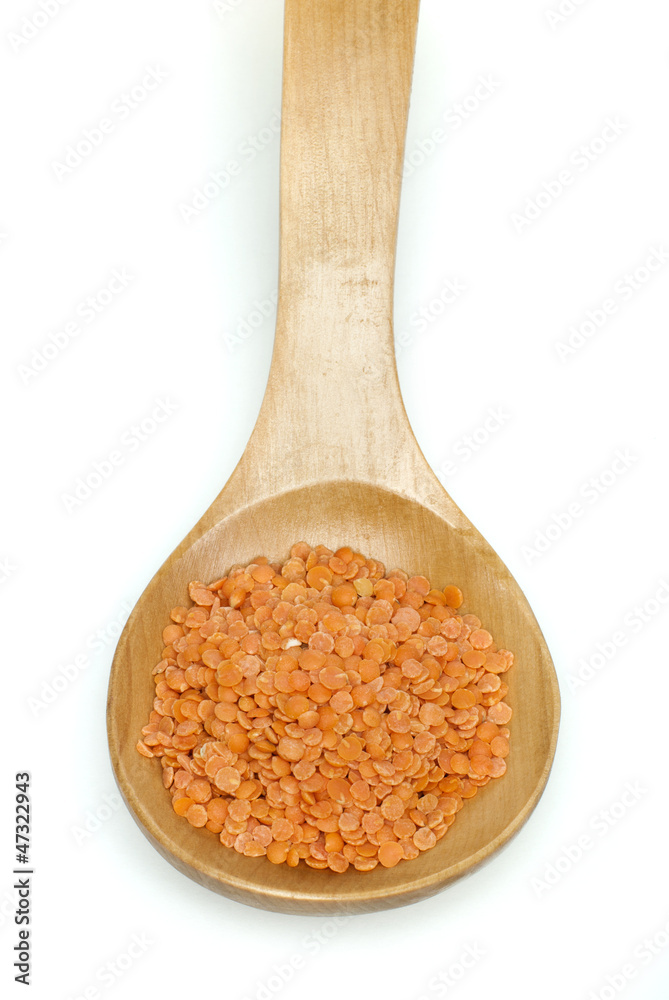 Lentil split in wooden spoon Lentil split in wooden spoon