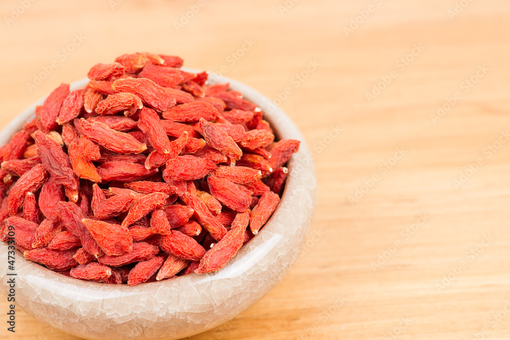 dried wolfberry fruit in bowl on the table dried wolfberry fruit in bowl on the table