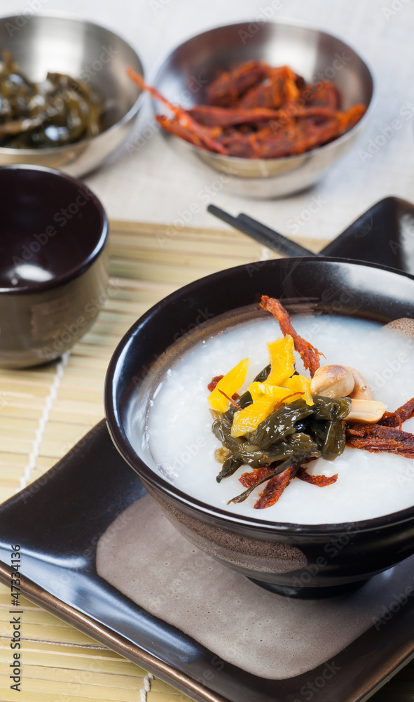 congee with dried beef, peanuts, preserve turnips and sea weeds congee with dried beef, peanuts, preserve turnips and sea weeds