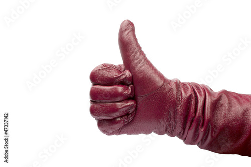Closeup of hand in red glove showing thumbs up