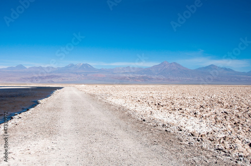 Gravel road at salt flat of Atacama (Chile)