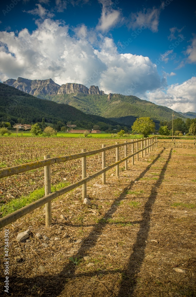 Small wooden fence in field