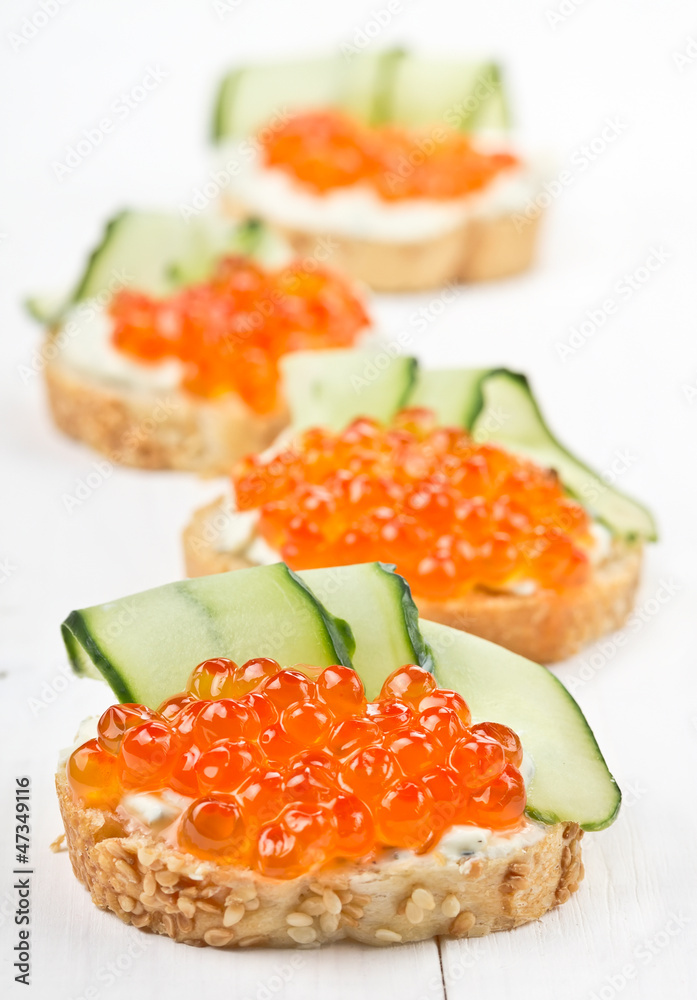 Sandwiches with red caviar and cream cheese Sandwiches with red caviar and cream cheese