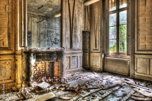 Broken fireplace in an abandoned derelict room