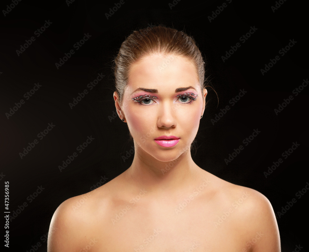 Woman with exotic style makeup, isolated on black background Woman with exotic style makeup, isolated on black background
