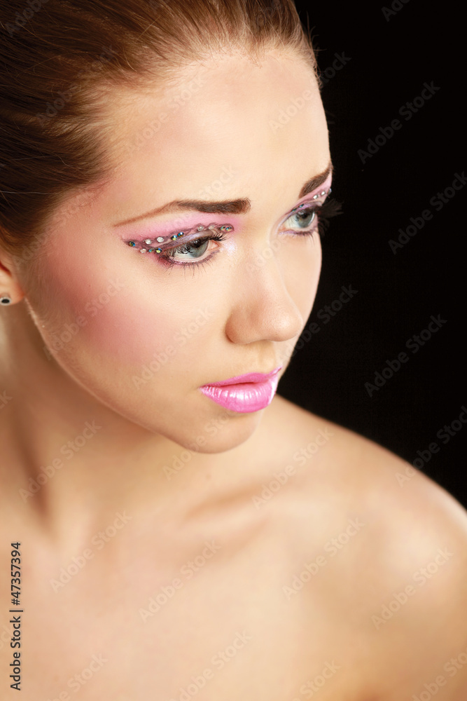 Woman with exotic style makeup, isolated on black background Woman with exotic style makeup, isolated on black background