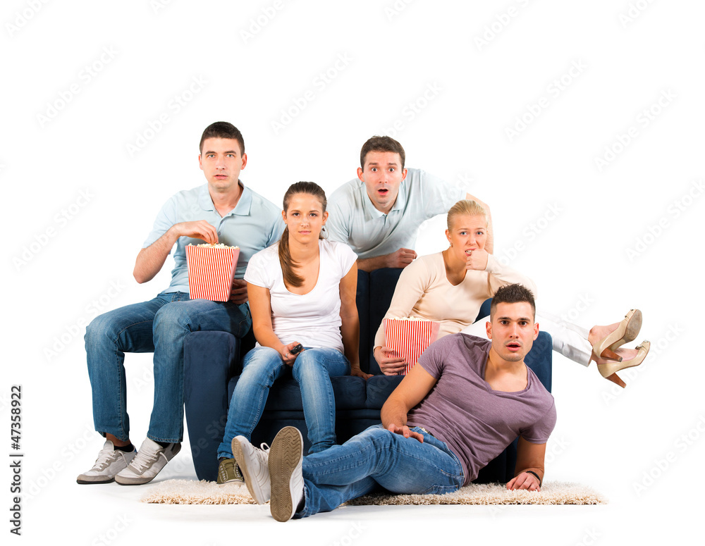 Fototapeta premium Young people sitting on a sofa on white background