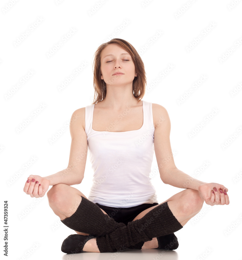 Young woman meditating in pose of lotus