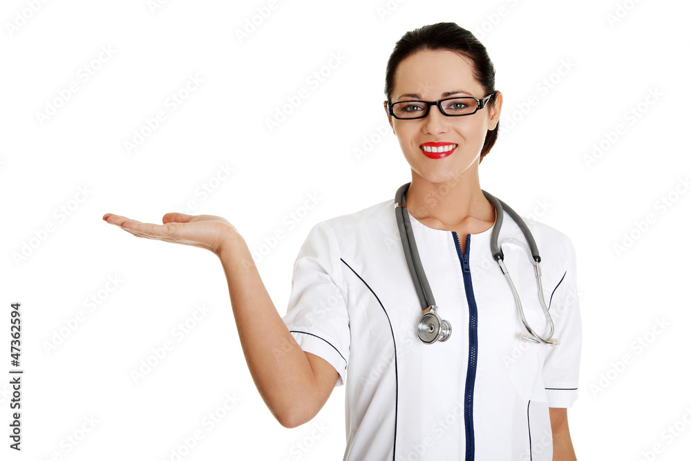 Medical doctor woman presenting copy space Medical doctor woman presenting copy space