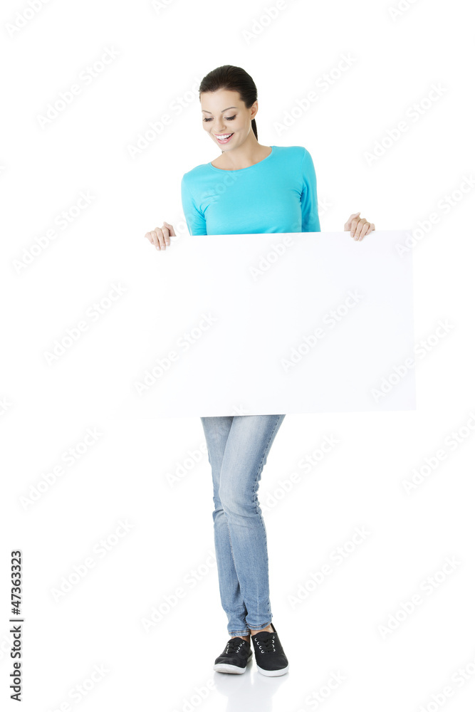 Portrait young happy woman with blank board Portrait young happy woman with blank board