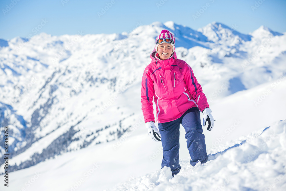 Young man with skis and a ski wear