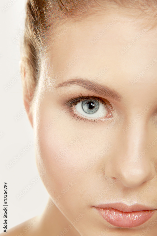 A half of a beautiful female's face, closeup, isolated on white A half of a beautiful female's face, closeup, isolated on white