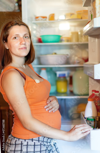  woman looking for something in refrigerator