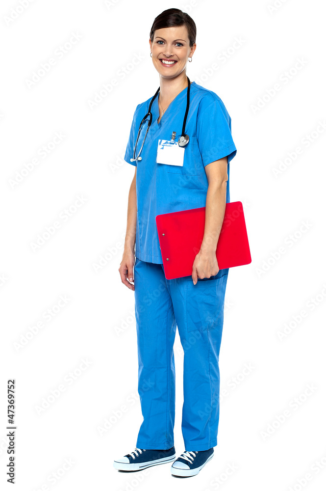 Nurse wearing blue uniform and holding red clipboard Nurse wearing blue uniform and holding red clipboard
