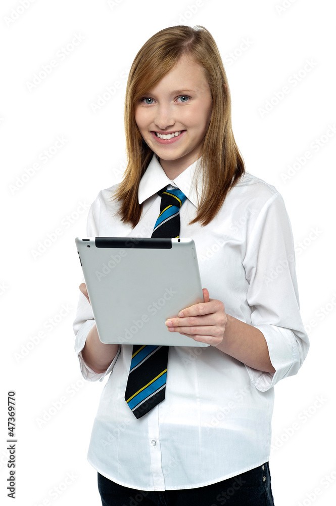 Gorgeous teenager browsing on her tablet pc Gorgeous teenager browsing on her tablet pc